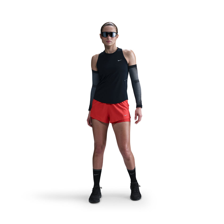 Front view of a model wearing a Nike Women's Swift Dri-FIT Running Tank Top in the Black/Reflective Silver colourway. (8560470524066)