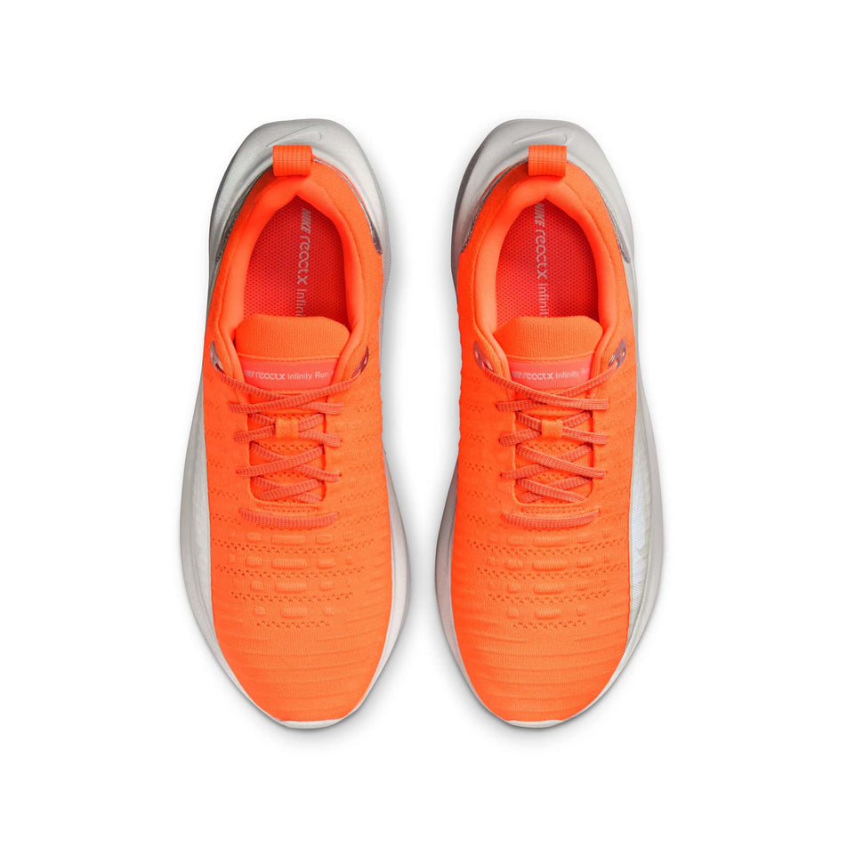 The uppers on a pair of Nike Men's InfinityRN 4 Premium Road Running Shoes in the Hyper Crimson/Metallic Silver colourway. (8524545392802)