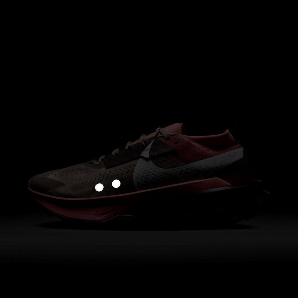 The reflectivity on the lateral side of the left shoe from a pair of Nike Men's Zegama Trail 2 Trail Running Shoes in the Khaki/White-Hyper Crimson-Burgundy Crush colourway. (8524550144162)