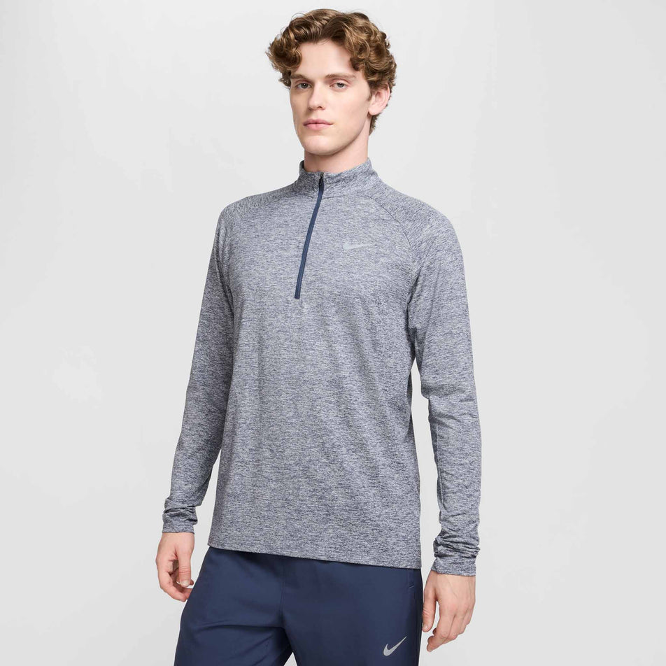 Front view of a model wearing the Nike Men's Stride Dri-FIT Half-Zip Midlayer in the Thunder Blue/Heather/Reflective Silver colourway. (8560377069730)