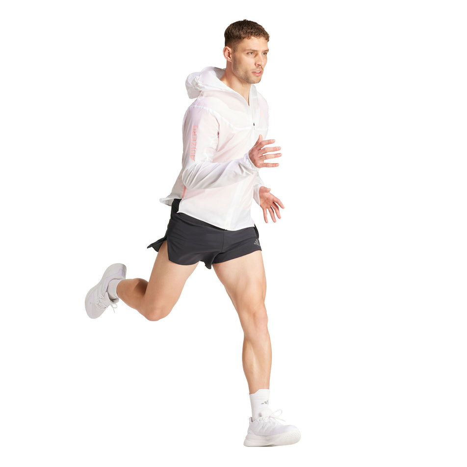 A model wearing the adidas Men's Adizero Running Gel Short in the black colourway. Model is also wearing a top, socks and shoes, and is in a running pose. (8449511850146)