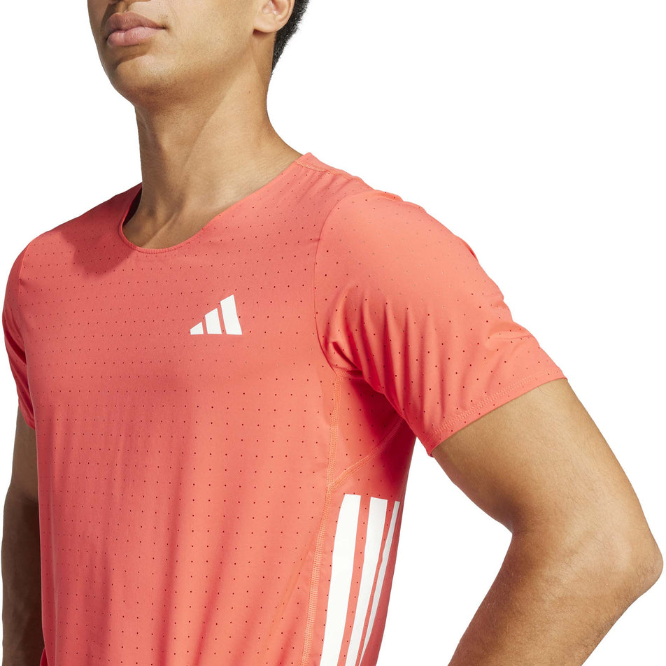 Front view of a model wearing the adidas Men's Adizero Tee in the Semi Lucid Red colourway. (8566631891106)