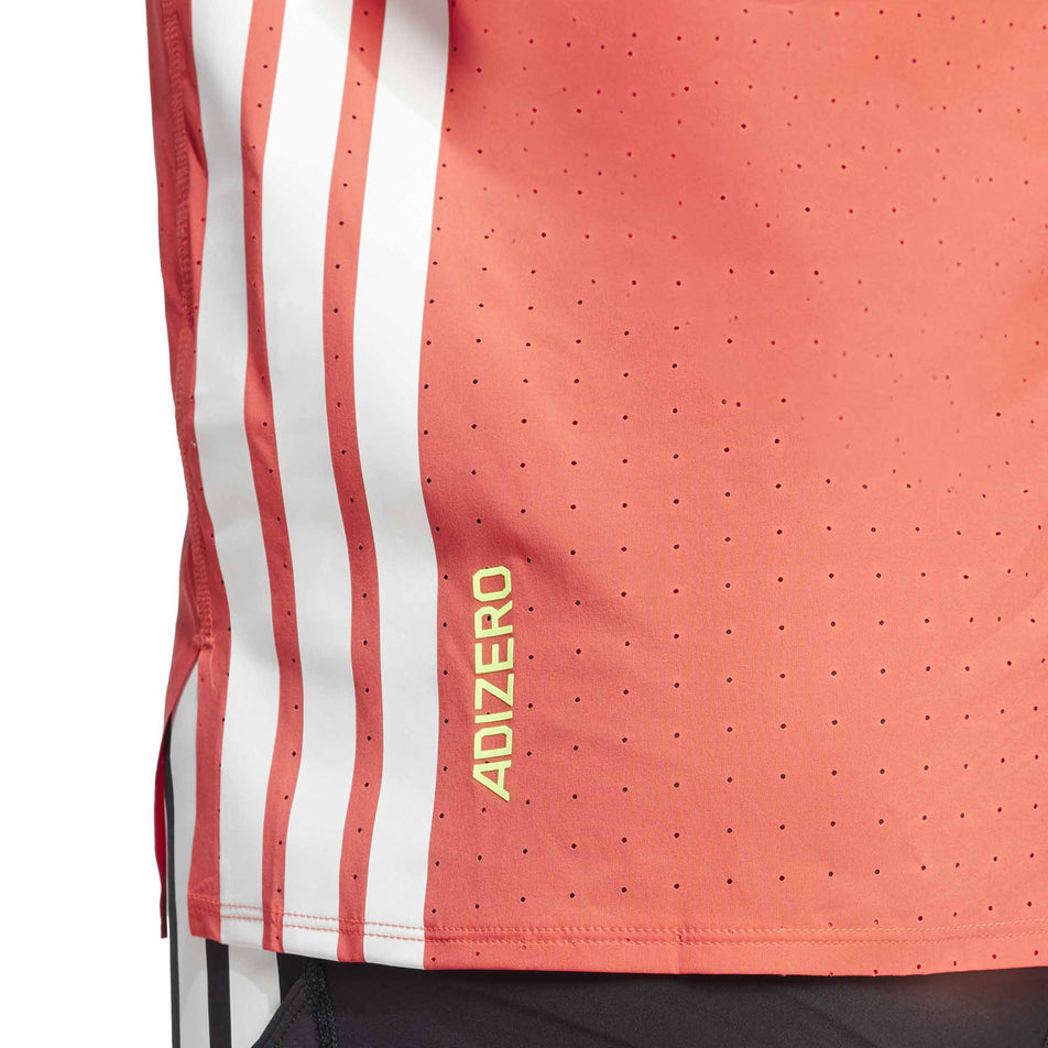 The three stripes and Adizero branding on the side of the adidas Men's Adizero Tee in the Semi Lucid Red colourway. (8566631891106)