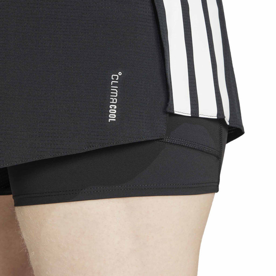 The CLIMACOOL logo on the adidas Men's Adizero 2in1 Short in the Black colourway.  (8566982148258)