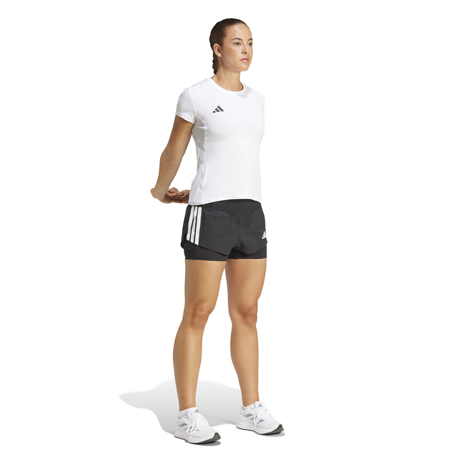 Front view of a model wearing the adidas Women's Adizero 2in1 Short in the Black colourway. (8567010525346)