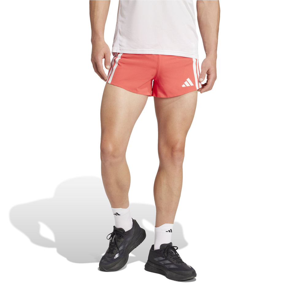 Front view of a model wearing the adidas Men's Adizero Gel Short in the Semi Lucid Red colourway. (8566998794402)