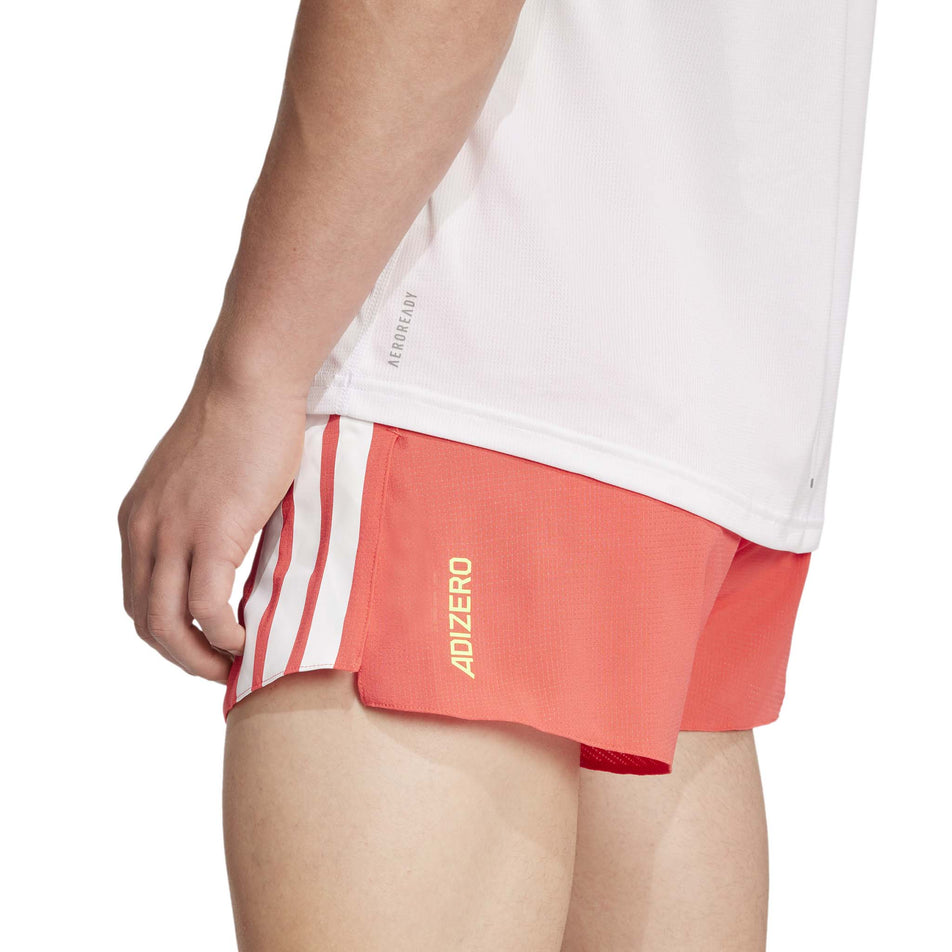 Back view of a model wearing the adidas Men's Adizero Gel Short in the Semi Lucid Red colourway. (8566998794402)