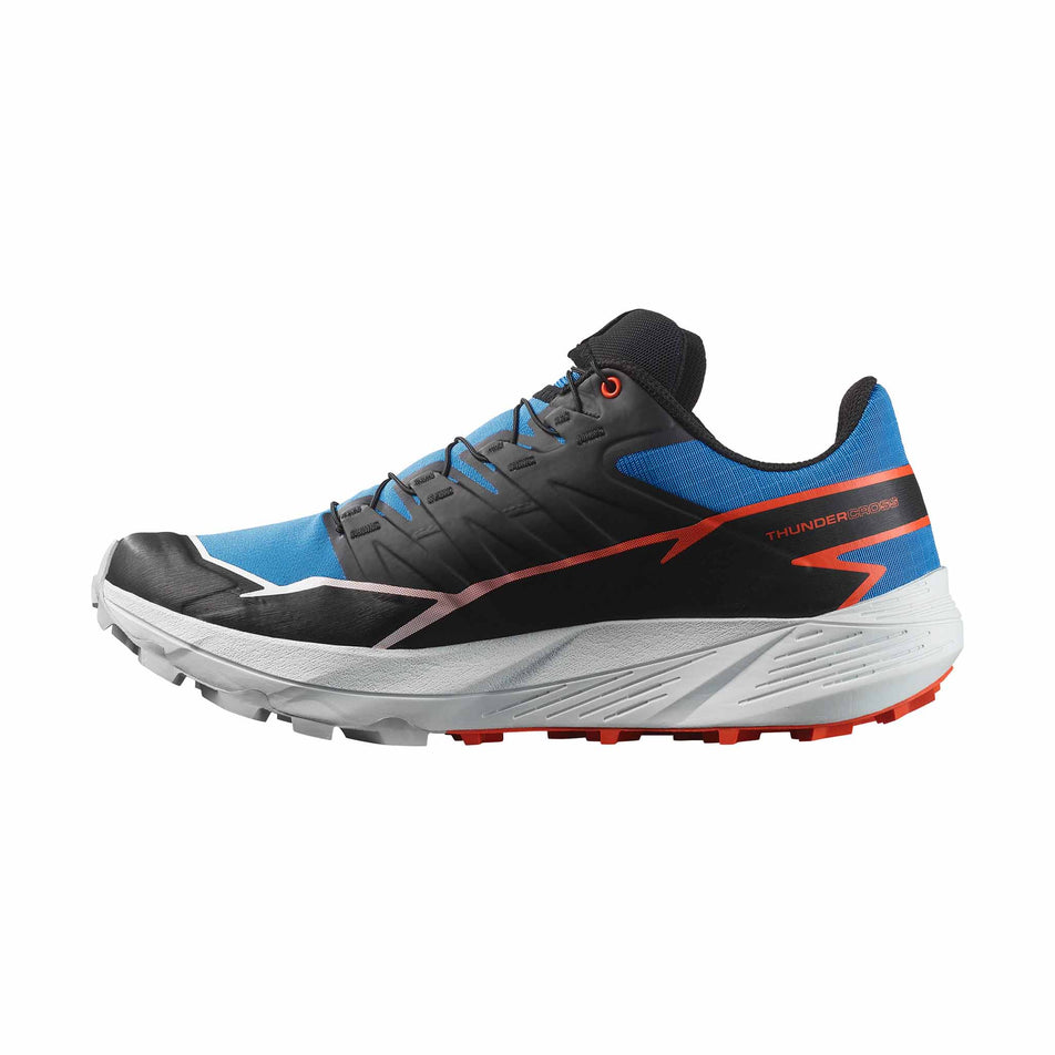 Medial side of the right shoe from a pair of Salomon Men's Thundercross Running Shoes  in the French Blue/Black/Cherry Tomato colourway. (8560936288418)