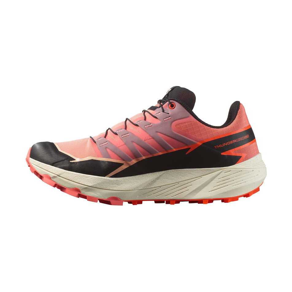 Medial side of the right shoe from a pair of Salomon Women's Thundercross Running Shoes in the Fusion Coral/Black/Red Orange colourway. (8561652072610)