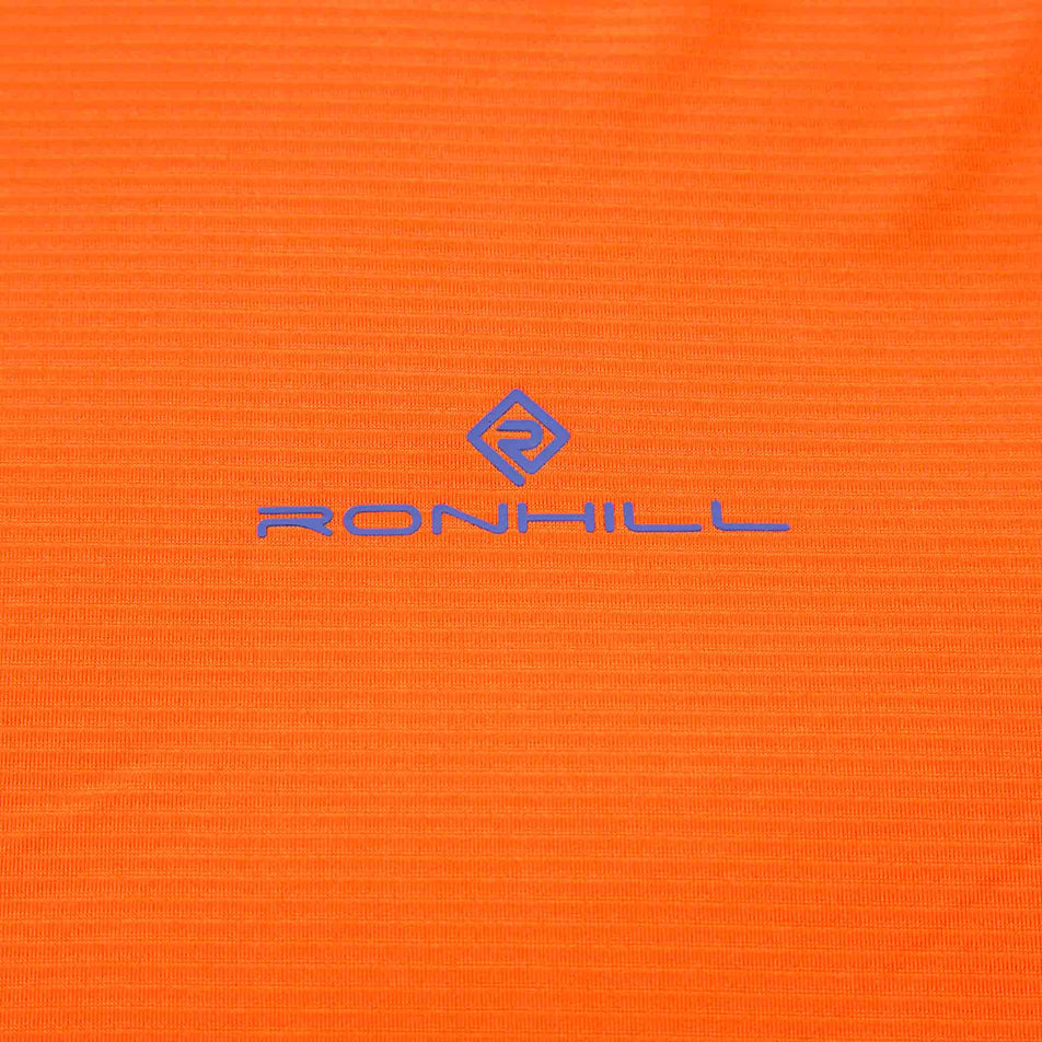 Close-up of the fabric and Ronhill logo on the front of the Ronhill Men's Tech S/S Tee. (8490372726946)