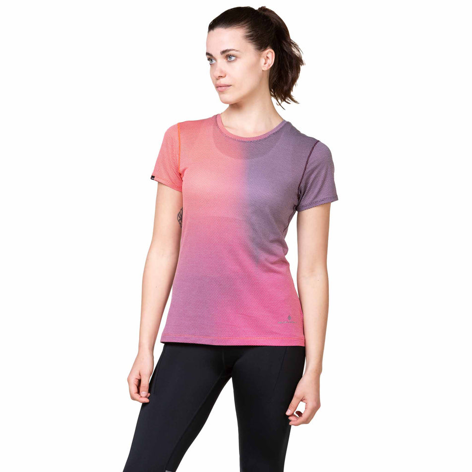 Front view of a model wearing the Ronhill Women's Tech Golden Hour Tee in the Damson/Sunset Merge colourway. (8563589709986)