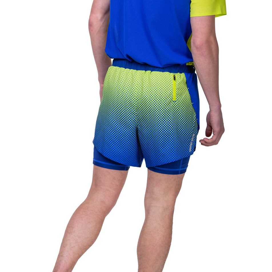 Front view of a model wearing the Ronhill Men's Tech Race Twin Short in the Azurite/Citrus Fade colourway. Model is wearing a Ronhill running t-shirt too. (8270451409058)