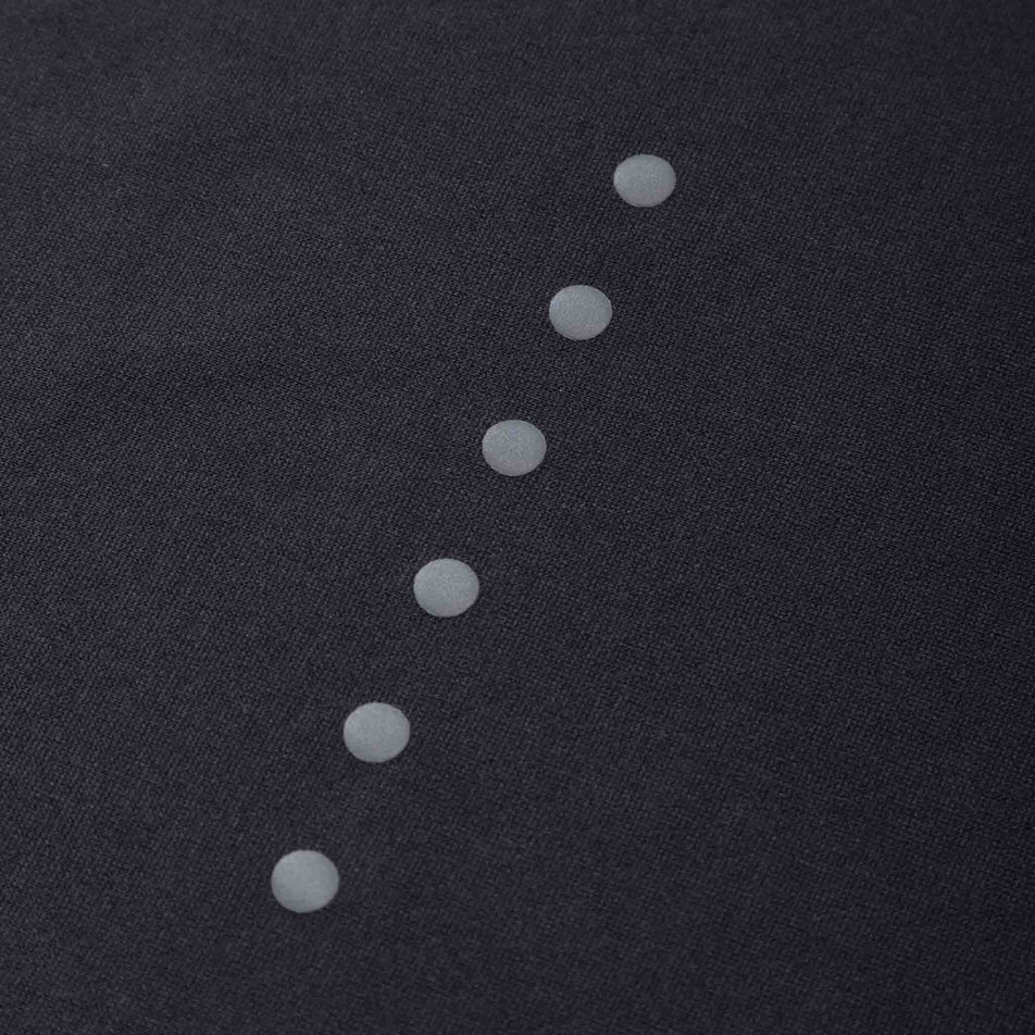 Close-up of the reflective dots on the back of the Ronhill Men's Core Vest in the Black/Bright White colourway. (8490972020898)