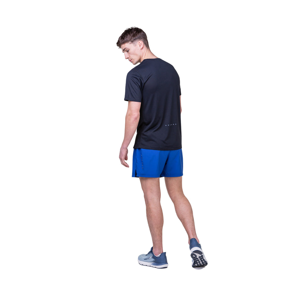 Back view of a model wearing the Ronhill Men's Core S/S Tee in the Black/Bright White colourway. Model is also wearing Ronhill shorts and Altra shoes. (8490970120354)