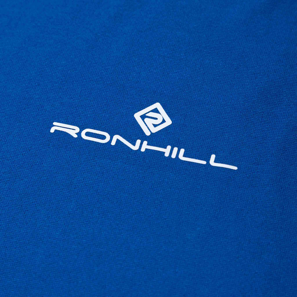 Close-up of the Ronhill logo on a Ronhill Men's Core L/S Tee. (8468452049058)