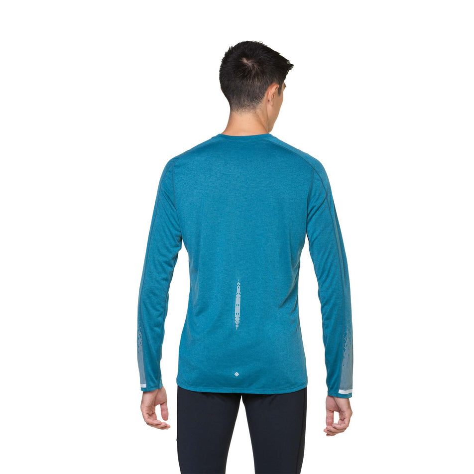 Back view of a model wearing a Ronhill Men's Tech Reflect L/S Tee in the Deep Teal/Reflect colourway. (8490211573922)