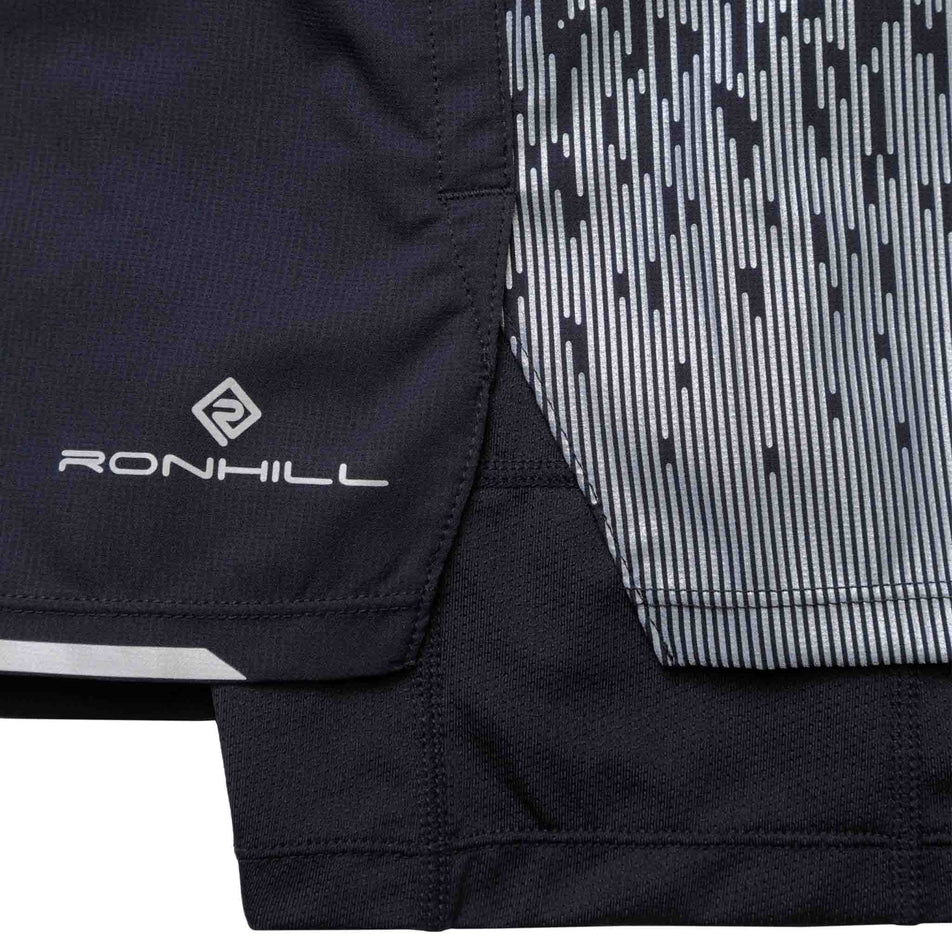 Close-up of the Ronhill logo and some of the reflective details on the Ronhill Men's Tech Reflect 5