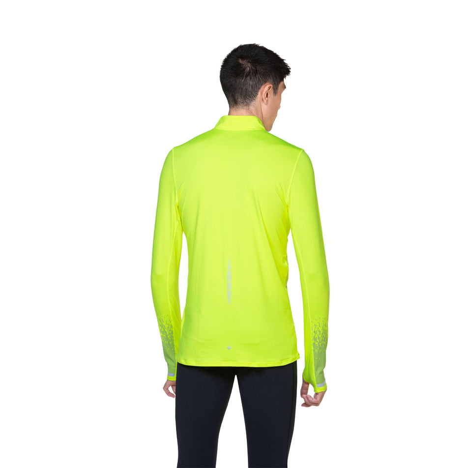 Back view of a model wearing a Ronhill Men's Tech Reflect 1/2 Zip in the Fluo Yellow/Reflect colourway. Model is also wearing leggings. (8469627207842)