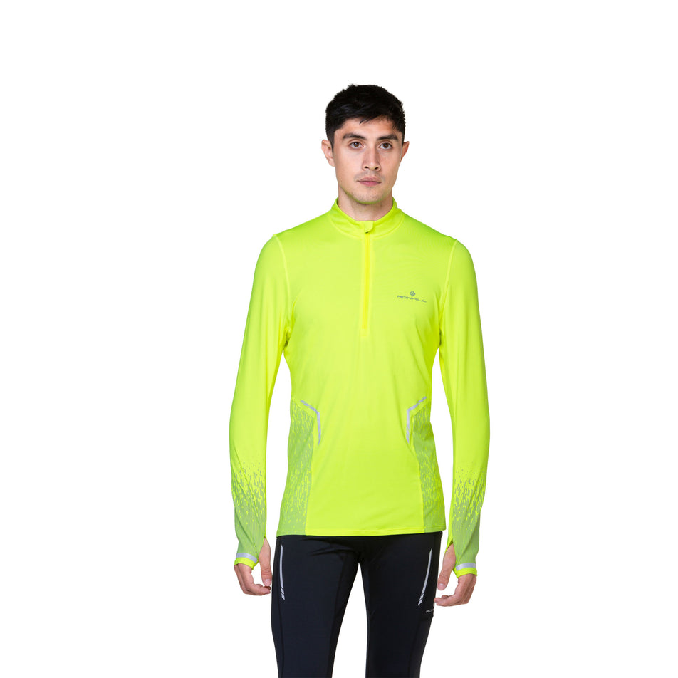 Front view of a model wearing a Ronhill Men's Tech Reflect 1/2 Zip in the Fluo Yellow/Reflect colourway. Model is also wearing leggings. (8469627207842)