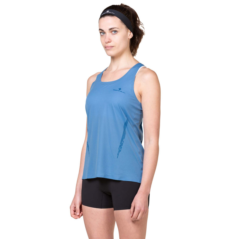 Front view of a model wearing the Ronhill Women's Tech Race Stretch Short in the All Black colourway. (8563585089698)