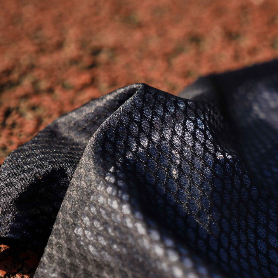 Close-up fabric on the lower section of the Pressio Run4It Run Club Men's Elite Singlet.  (8489124266146)