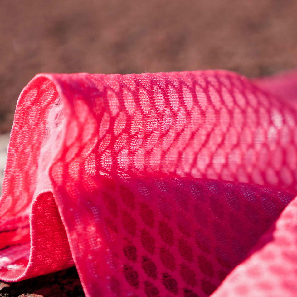 Close-up fabric on the lower section of the Pressio Run4It Run Club Women's Elite Tee.  (8489111388322)