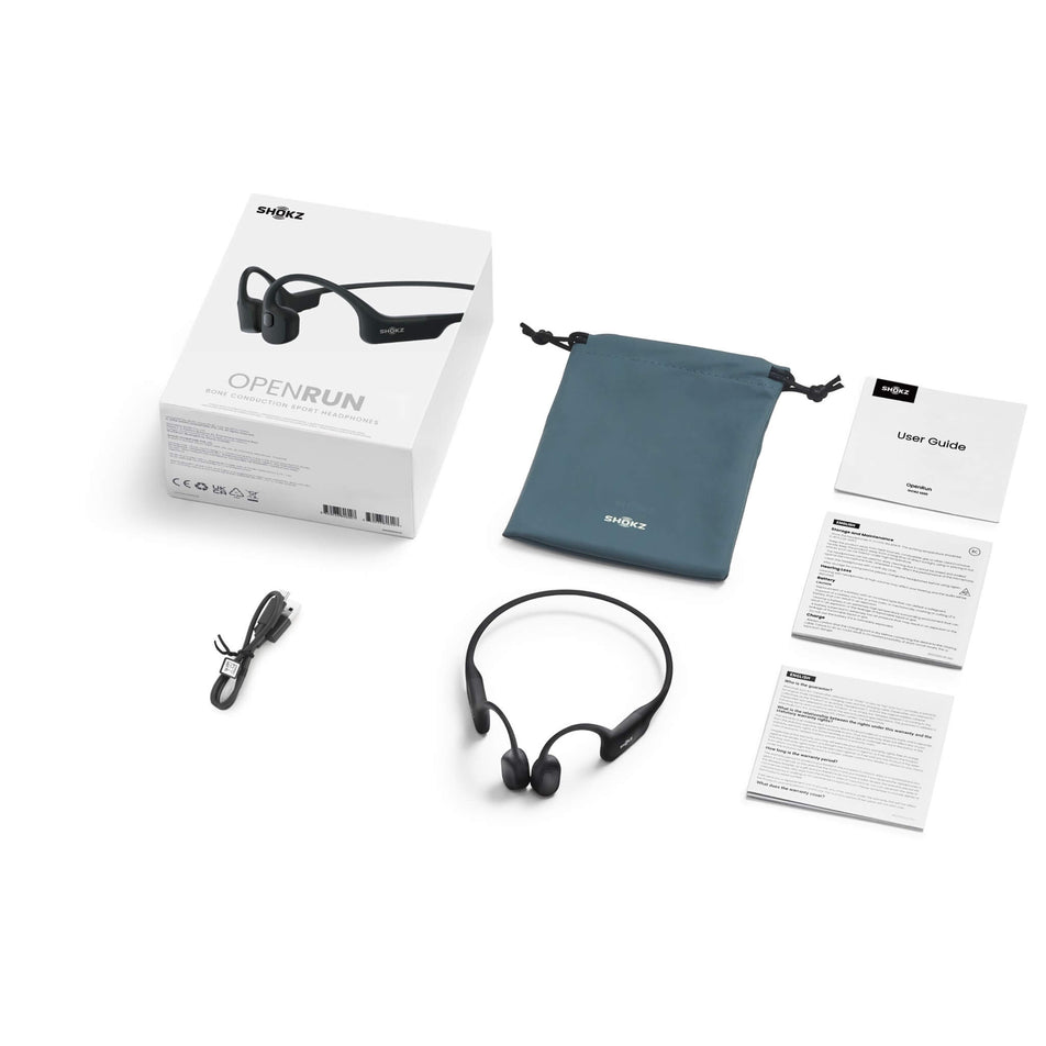 The box, carry bag, charging cable, user guide, and a pair of Shokz Unisex OpenRun Wireless Bone Conduction Headphones in the Black colourway. (8541472653474)