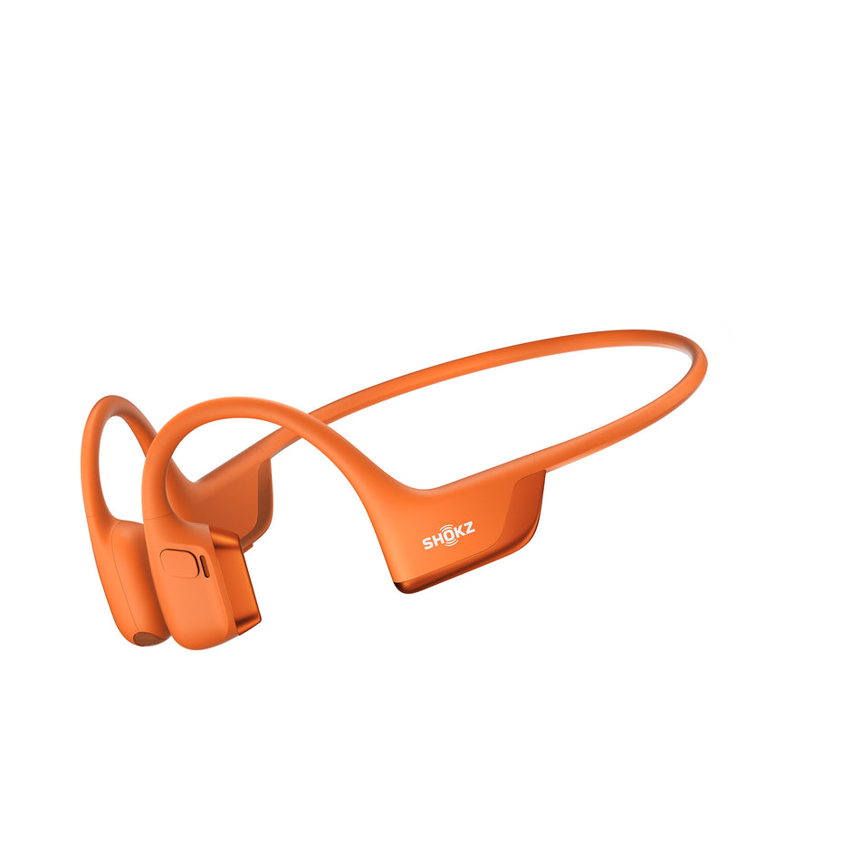 A pair of Shokz Unisex OpenRun Pro 2 Mini Wireless Bone Conduction Headphones in the Orange colourway.  (8541433299106)