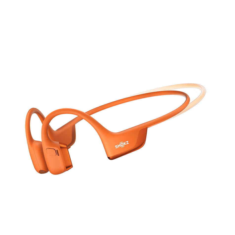 A pair of Shokz Unisex OpenRun Pro 2 Mini Wireless Bone Conduction Headphones, in the Orange colourway, against the outline of the standard size.  (8541433299106)