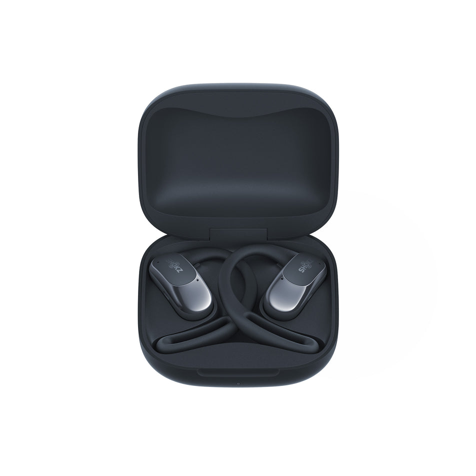 A pair of Shokz Unisex OpenFit Air Headphones, in the Black colourway, inside the charging case.  (8541403906210)