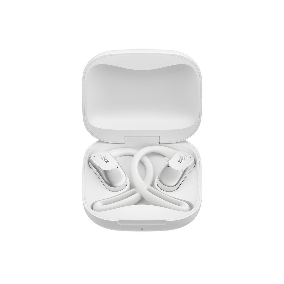 A pair of Shokz Unisex OpenFit Air Headphones, in the White colourway, inside the charging case.   (8541407674530)