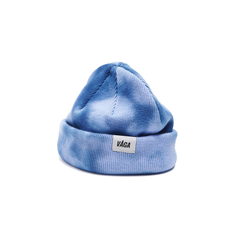 A VAGA Unisex Fine Rib Tie Dye Beanie in the Blue/Postal Blue colourway, with the cuff turned up.  (8551972864162)