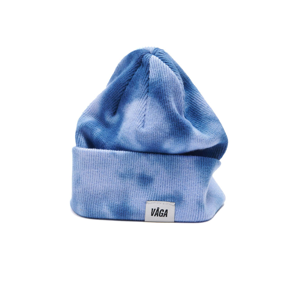 A VAGA Unisex Fine Rib Tie Dye Beanie in the Blue/Postal Blue colourway, with the cuff turned down.  (8551972864162)