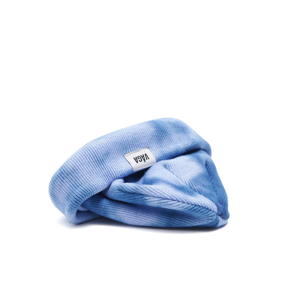 A VAGA Unisex Fine Rib Tie Dye Beanie in the Blue/Postal Blue colourway, with the cuff turned up.  (8551972864162)