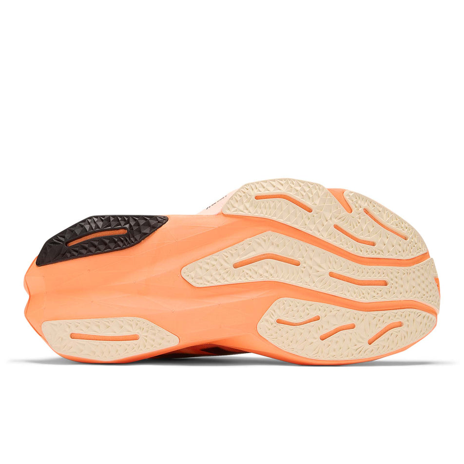 The outsole of the right shoe from a pair of New Balance Women's FuelCell Rebel V4 Running Shoes in the Hot Mango colourway. (8569898369186)